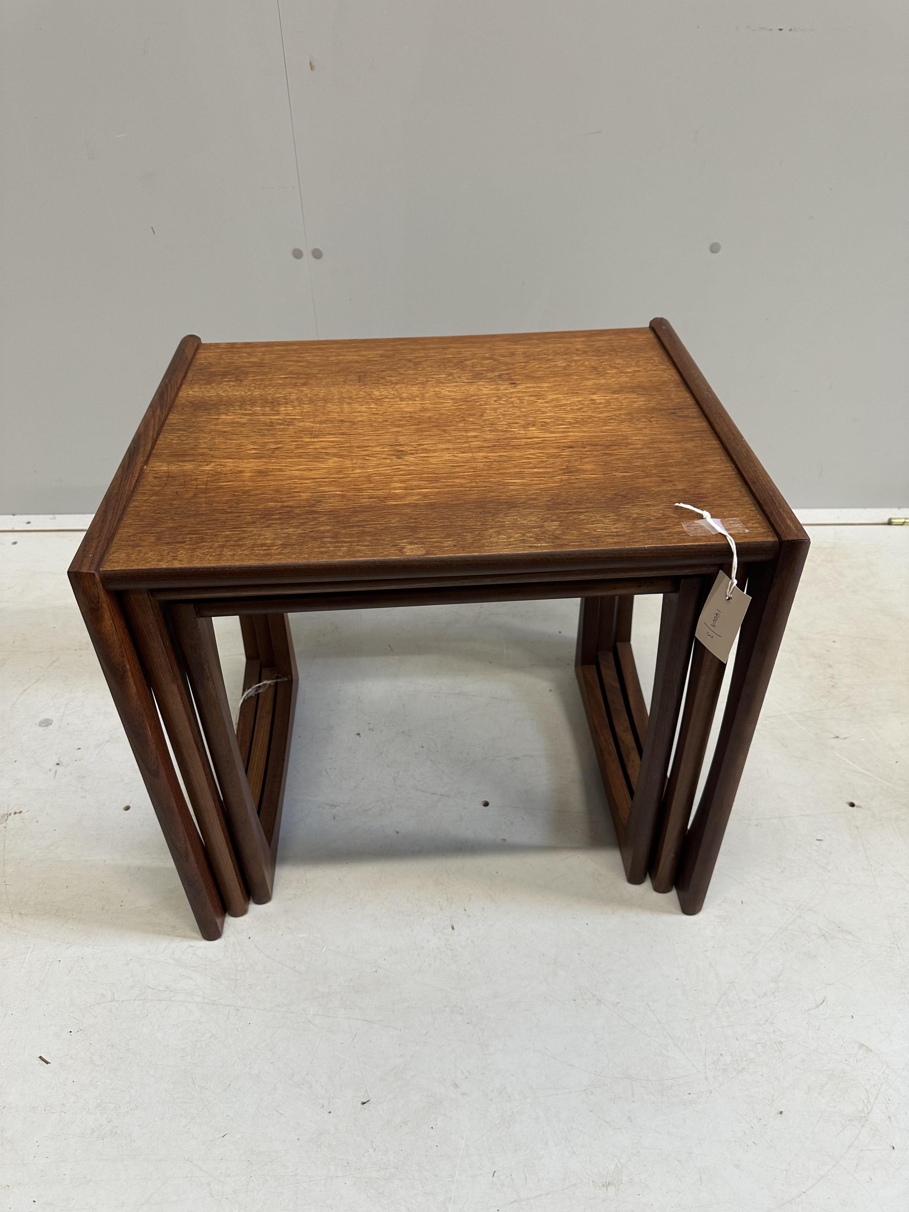 A nest of three mid century G Plan teak tea tables, width 53cm, depth 43cm, height 49cm. Condition - fair